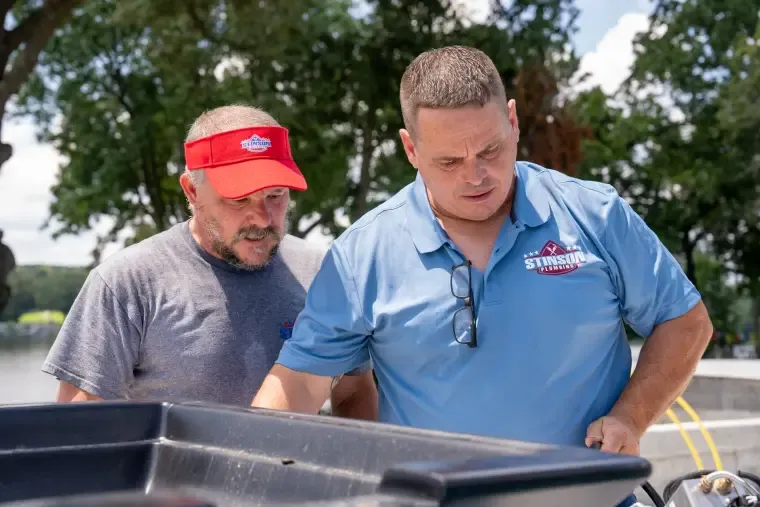 Two Stinson plumbers working a job together
